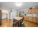 A kitchen with wooden cabinets, stainless steel appliances, and a light wood kitchen island with metal stools at 2095 Gherry Dr, Austell, GA 30106