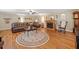 Warm living room showcasing hardwood floors, a ceiling fan and a fireplace with comfortable leather furniture at 2095 Gherry Dr, Austell, GA 30106