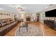 Inviting living room with a brick fireplace, wood floors, ceiling fan and comfortable leather seating at 2095 Gherry Dr, Austell, GA 30106