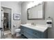 Clean, modern bathroom with gray vanity, large mirror, and walk-in shower at 330 Longvue Ct, Johns Creek, GA 30097