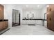 Large bathroom featuring a double vanity, modern fixtures, and views into walk-in closet at 330 Longvue Ct, Johns Creek, GA 30097