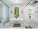 Modern bathroom with a soaking tub, glass shower, stylish fixtures, and a large window at 330 Longvue Ct, Johns Creek, GA 30097