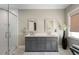Bathroom featuring double sinks, stylish fixtures, and a glass shower with modern finishes at 330 Longvue Ct, Johns Creek, GA 30097