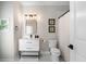 Bathroom featuring modern fixtures, shower with curtain, and checkered floors at 330 Longvue Ct, Johns Creek, GA 30097