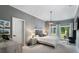 Bright bedroom with neutral tones, large window, and decorative lighting provides a peaceful retreat at 330 Longvue Ct, Johns Creek, GA 30097