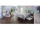 Bright bedroom with a white color scheme, a decorative vanity, a cozy seating area, and natural light at 330 Longvue Ct, Johns Creek, GA 30097