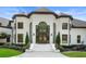 Elegant home showcasing the front door, manicured landscaping, and a grand entrance at 330 Longvue Ct, Johns Creek, GA 30097