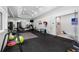 Spacious home gym with mirrored walls and a variety of exercise equipment for a complete workout at 330 Longvue Ct, Johns Creek, GA 30097