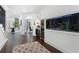 Open hallway with hardwood floors and a built-in fish tank, bar, and wine storage at 330 Longvue Ct, Johns Creek, GA 30097