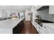 Modern kitchen featuring a long island, white cabinets, and stainless steel appliances at 330 Longvue Ct, Johns Creek, GA 30097