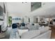 Spacious living area featuring a fireplace, tall windows, and adjacent dining and kitchen areas for an open concept design at 330 Longvue Ct, Johns Creek, GA 30097