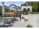 Luxurious poolside with lounge chairs and built-in grill is an entertainer's paradise at 330 Longvue Ct, Johns Creek, GA 30097