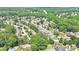 A beautiful aerial view of a suburban neighborhood surrounded by lush greenery and mature trees at 445 Sweet Ivy Ln, Lawrenceville, GA 30043