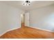 Spacious bedroom with hardwood floors, neutral walls, and modern lighting fixtures at 445 Sweet Ivy Ln, Lawrenceville, GA 30043