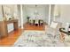 Light-filled dining area with hardwood floors, crown molding, and stylish decor at 445 Sweet Ivy Ln, Lawrenceville, GA 30043