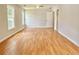 Empty room with hardwood floors and multiple windows at 445 Sweet Ivy Ln, Lawrenceville, GA 30043