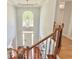 View from above of the foyer featuring wood staircase and hardwood flooring at 445 Sweet Ivy Ln, Lawrenceville, GA 30043