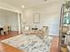 Cozy living room featuring hardwood floors, rug, chairs, and decor at 445 Sweet Ivy Ln, Lawrenceville, GA 30043