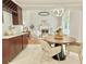 Open-concept kitchen and living area with hardwood flooring, fireplace and stylish decor at 445 Sweet Ivy Ln, Lawrenceville, GA 30043