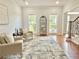 Bright living room featuring hardwood floors, neutral paint, and decorative accents at 445 Sweet Ivy Ln, Lawrenceville, GA 30043