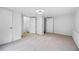 Finished basement with plush carpet, multiple doors, and ample space at 6402 Grafton Ct, Austell, GA 30168