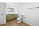 Modern bathroom with olive green vanity, dual sinks, and updated fixtures at 6402 Grafton Ct, Austell, GA 30168