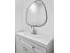 Bathroom featuring a stylish mirror, single sink, and vanity with storage at 6402 Grafton Ct, Austell, GA 30168