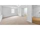 Large bedroom with neutral carpet, white walls, and window at 6402 Grafton Ct, Austell, GA 30168