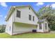 Two-story home with white siding and green grass at 6402 Grafton Ct, Austell, GA 30168