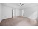 Expansive main bedroom with neutral carpet and multiple closets and doorways at 6402 Grafton Ct, Austell, GA 30168