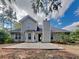 Exterior view of home showing the backyard and patio with a chimney at 115 Hugh Dr, Covington, GA 30016