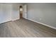 Bedroom with new floors, white trim, and double closets at 115 Hugh Dr, Covington, GA 30016