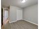 Well-lit bedroom featuring neutral walls, light-colored floors, and a closet at 115 Hugh Dr, Covington, GA 30016