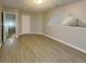 Spacious bonus room featuring neutral walls, light-colored floors, and a view into the hallway at 115 Hugh Dr, Covington, GA 30016