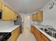 Kitchen featuring stainless steel appliances, granite countertops, and stainless steel sink at 115 Hugh Dr, Covington, GA 30016