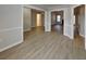 Open living space with light grey walls, white trim, and new floors at 115 Hugh Dr, Covington, GA 30016