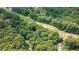 Birds-eye view of wooded property showing lush greenery and natural surroundings at 1526 Oakleaf Dr, Auburn, GA 30011