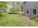 Backyard showing a charming home with a shed and a spacious, well-maintained lawn at 1526 Oakleaf Dr, Auburn, GA 30011