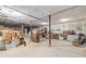 Spacious unfinished basement with concrete floor, white ceiling, and work bench area at 1526 Oakleaf Dr, Auburn, GA 30011