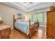 Main bedroom boasts hardwood floors, tray ceilings, and bay windows at 1526 Oakleaf Dr, Auburn, GA 30011