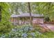 Two-story home featuring a welcoming front porch and an attached two-car garage at 1526 Oakleaf Dr, Auburn, GA 30011