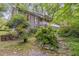 Side view of a home showcasing landscaped yard with stone steps at 1526 Oakleaf Dr, Auburn, GA 30011