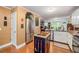 Bright open kitchen with stainless appliances, granite countertops, and island at 1526 Oakleaf Dr, Auburn, GA 30011