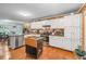 Eat-in kitchen features white cabinets, stainless steel appliances, and granite counters at 1526 Oakleaf Dr, Auburn, GA 30011