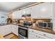 Kitchen with granite counters and stainless appliances and a great view at 1526 Oakleaf Dr, Auburn, GA 30011