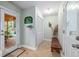 Mud room with ceramic floors and access to backyard deck and a full closet at 1526 Oakleaf Dr, Auburn, GA 30011