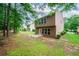 A spacious backyard features a patio and an expansive lawn at 162 Ledgewood Mill Way, Lawrenceville, GA 30045