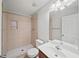 Bathroom featuring tiled walk-in shower, tile flooring and a sleek single sink vanity at 162 Ledgewood Mill Way, Lawrenceville, GA 30045