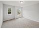 Bedroom featuring a window, carpet flooring, and a neutral color scheme at 162 Ledgewood Mill Way, Lawrenceville, GA 30045