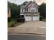 Charming two-story home with a two-car garage and a well-manicured front yard at 162 Ledgewood Mill Way, Lawrenceville, GA 30045